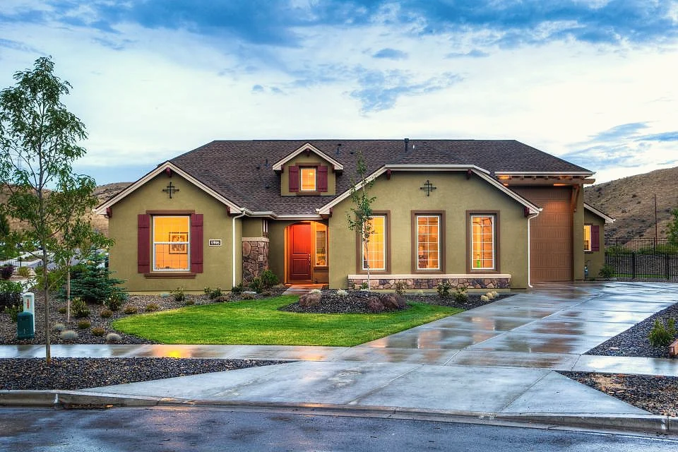 A single-story rental home with a green lawn