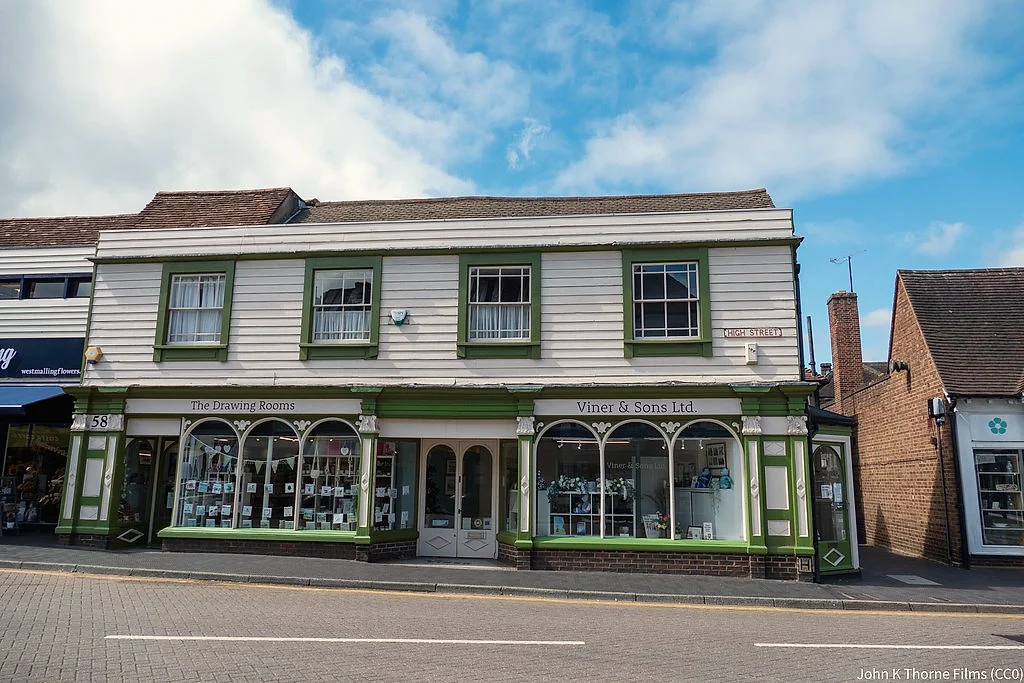 A row of street level shops with apartments above